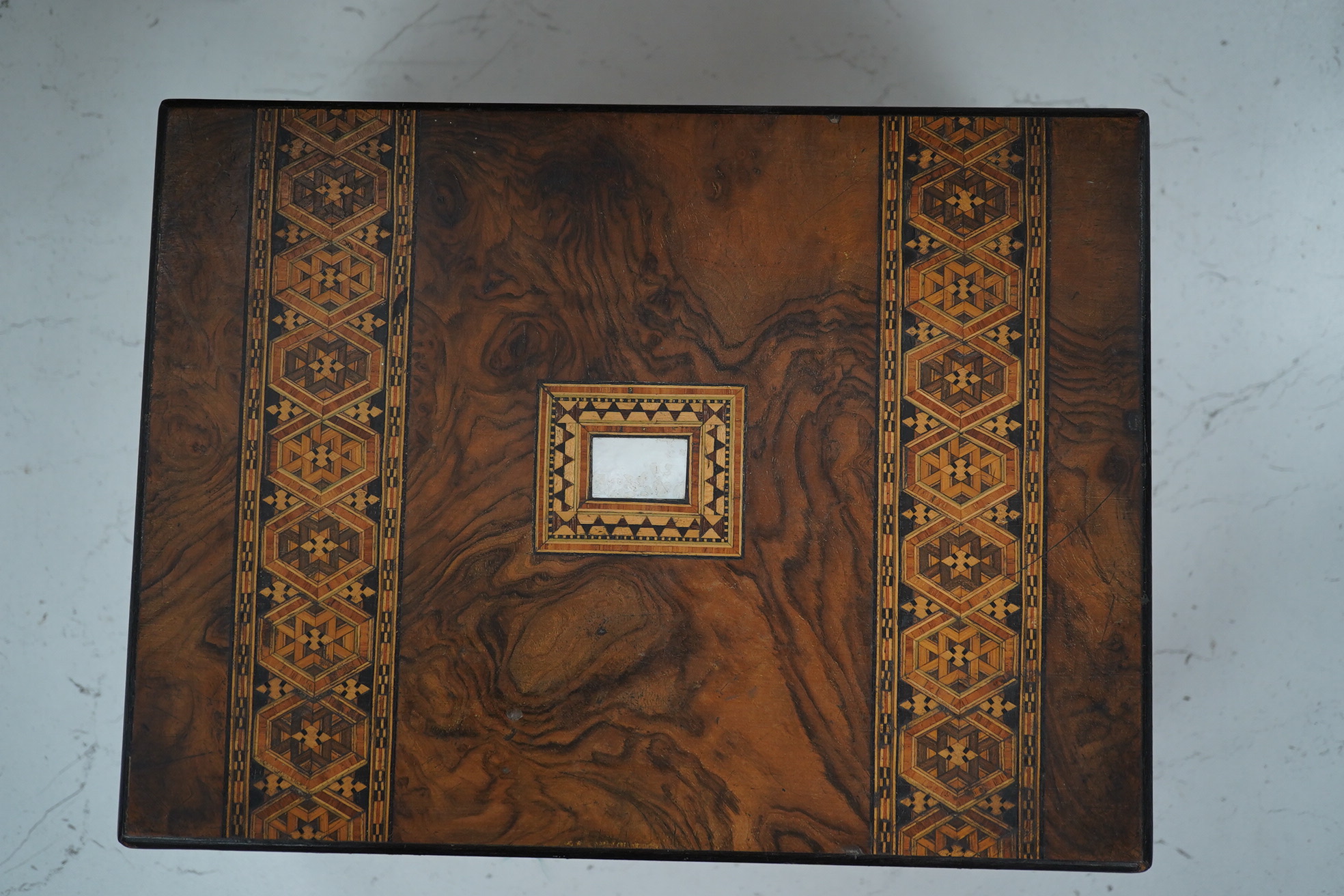 A mahogany brass mounted 19th century writing box and a walnut inlaid and mother of pearl writing box, brass mounted box, 35cm wide. Condition - exterior good, felt on slope torn.